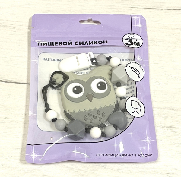 Упаковка для прорезывателя с держателем.